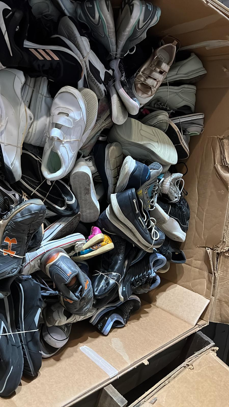 Box of used shoes
