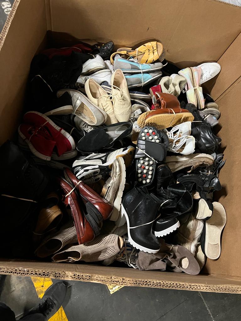 Box of used shoes
