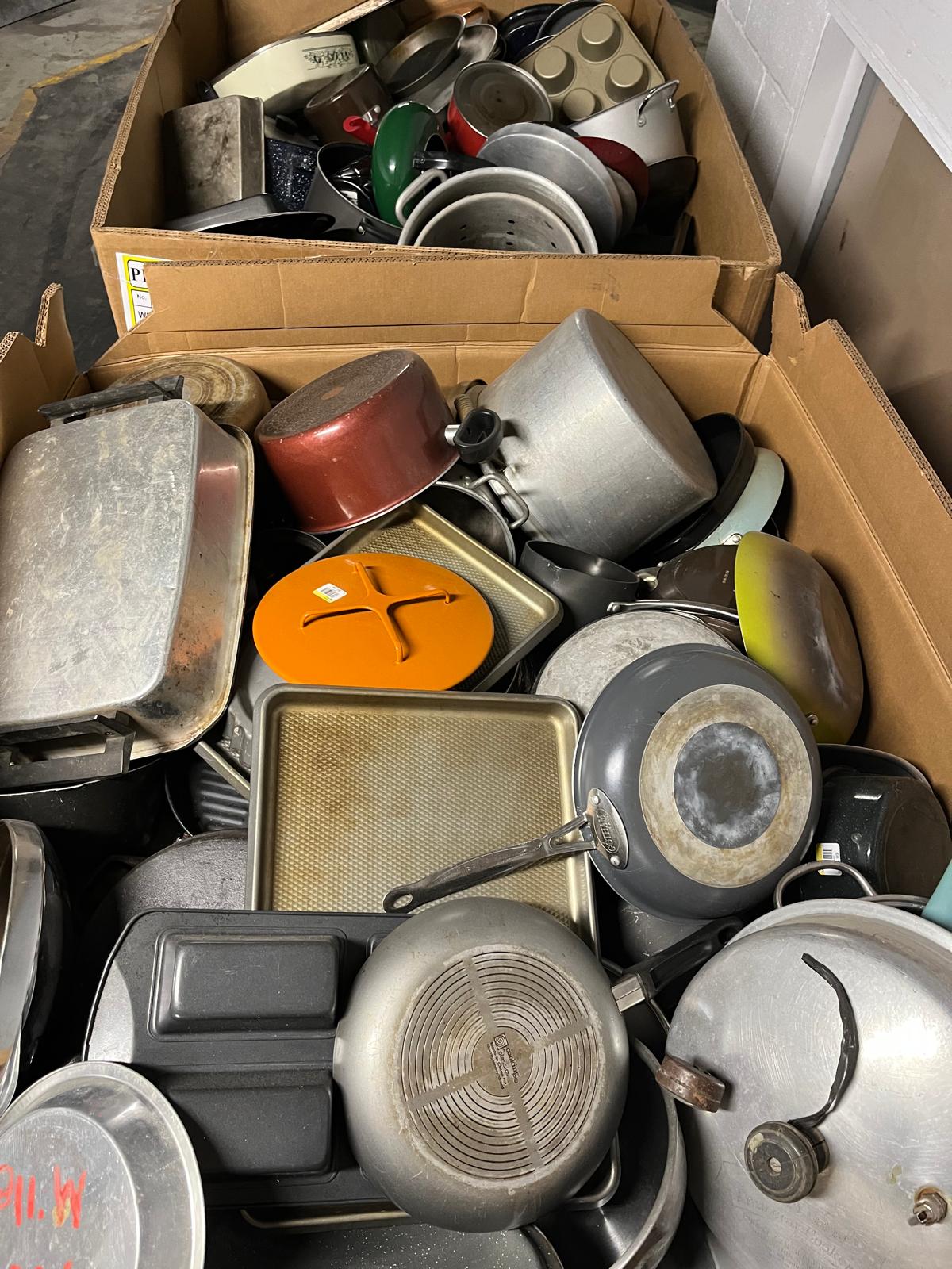 Box of used pots and pans